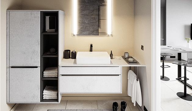 Meuble de salle de bain moderne avec lavabo blanc, rangements ouverts et fermés, miroir éclairé, et serviette accrochée, dans un décor minimaliste.